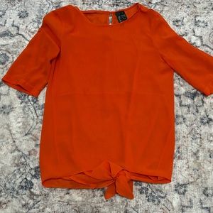 Orange sheer top